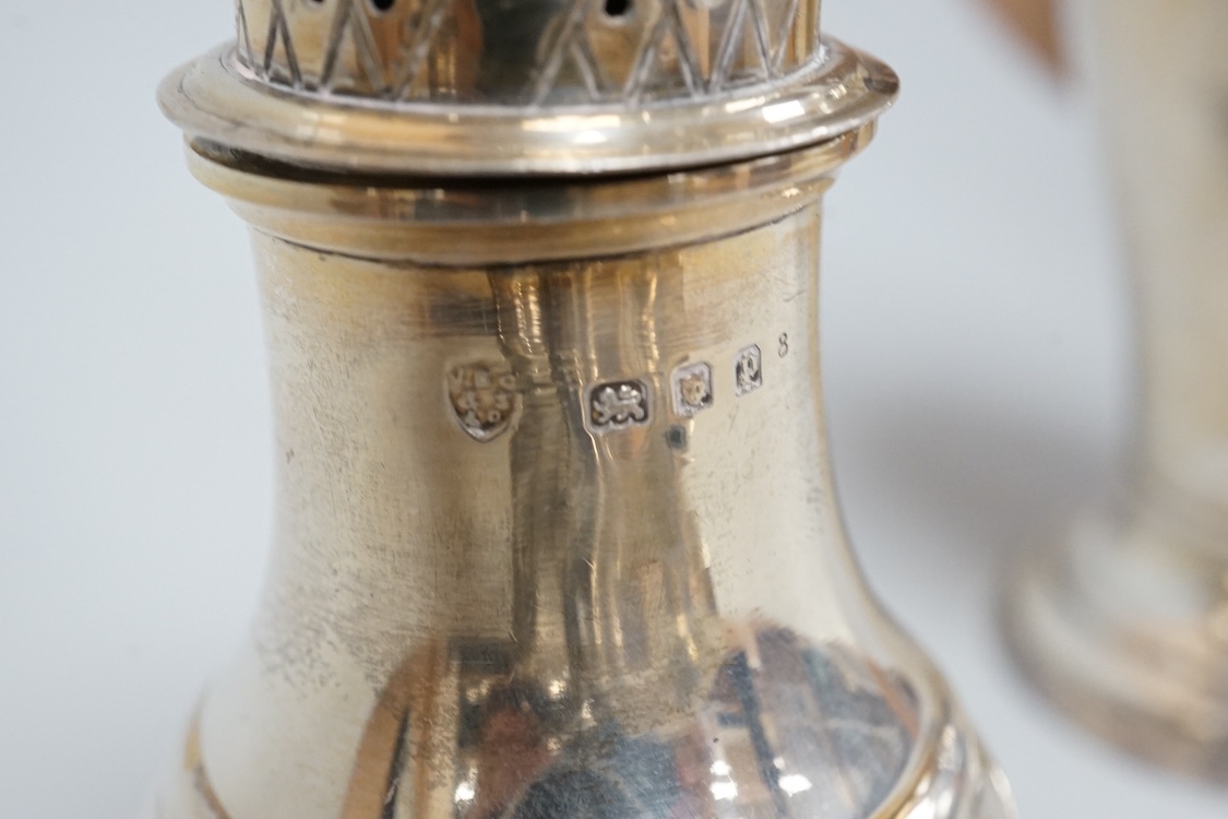 Two George V silver sauceboats, one by Asprey & Co, a silver pepperette, a silver bowl and a modern silver sugar caster, 16oz.